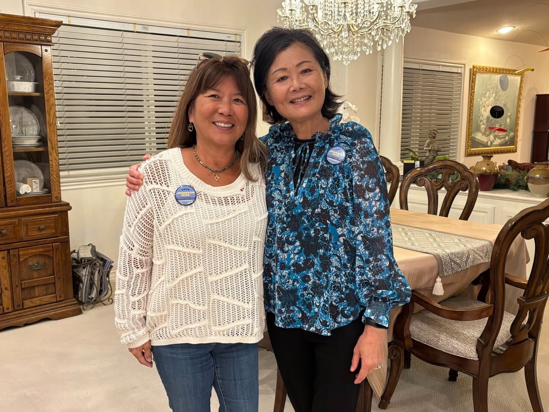 Jennifer Mak (right) with Michele Nadeau, both wearing Vote Jennifer Mak buttons