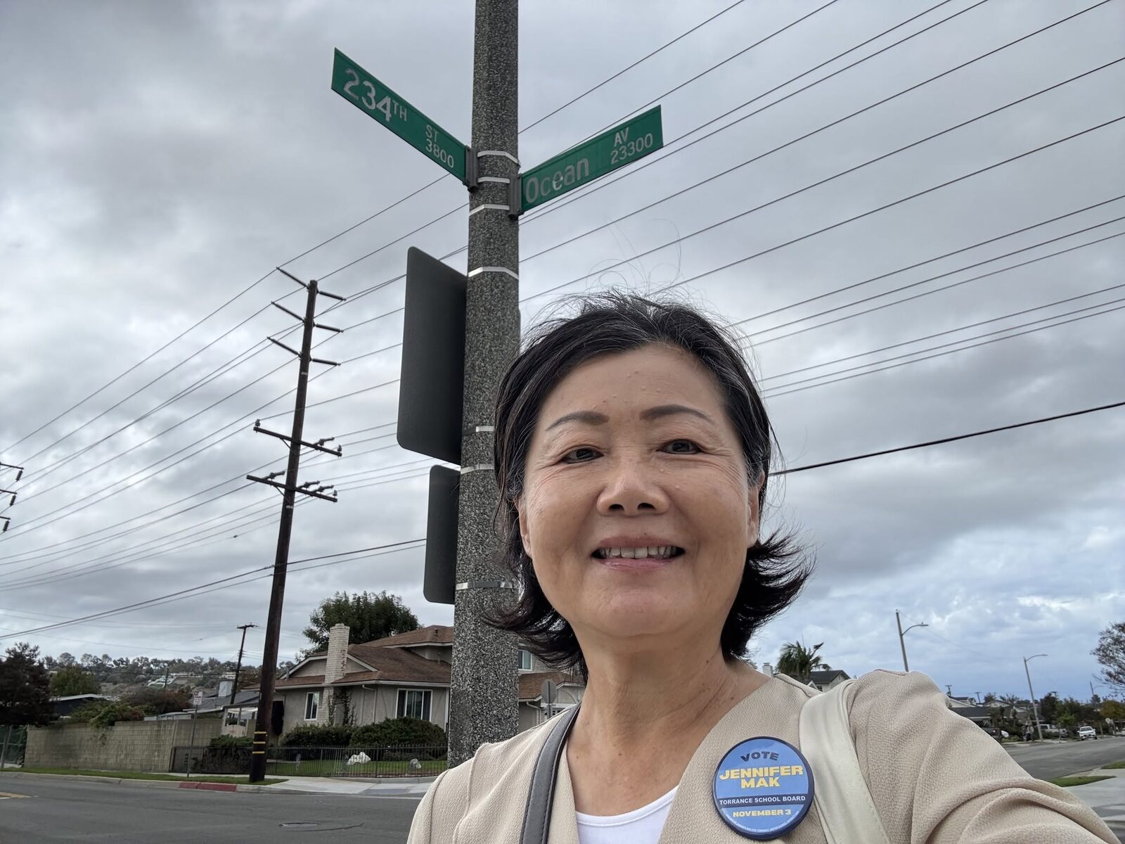 Jennifer Mak canvassing in Area D, wearing her campaign button