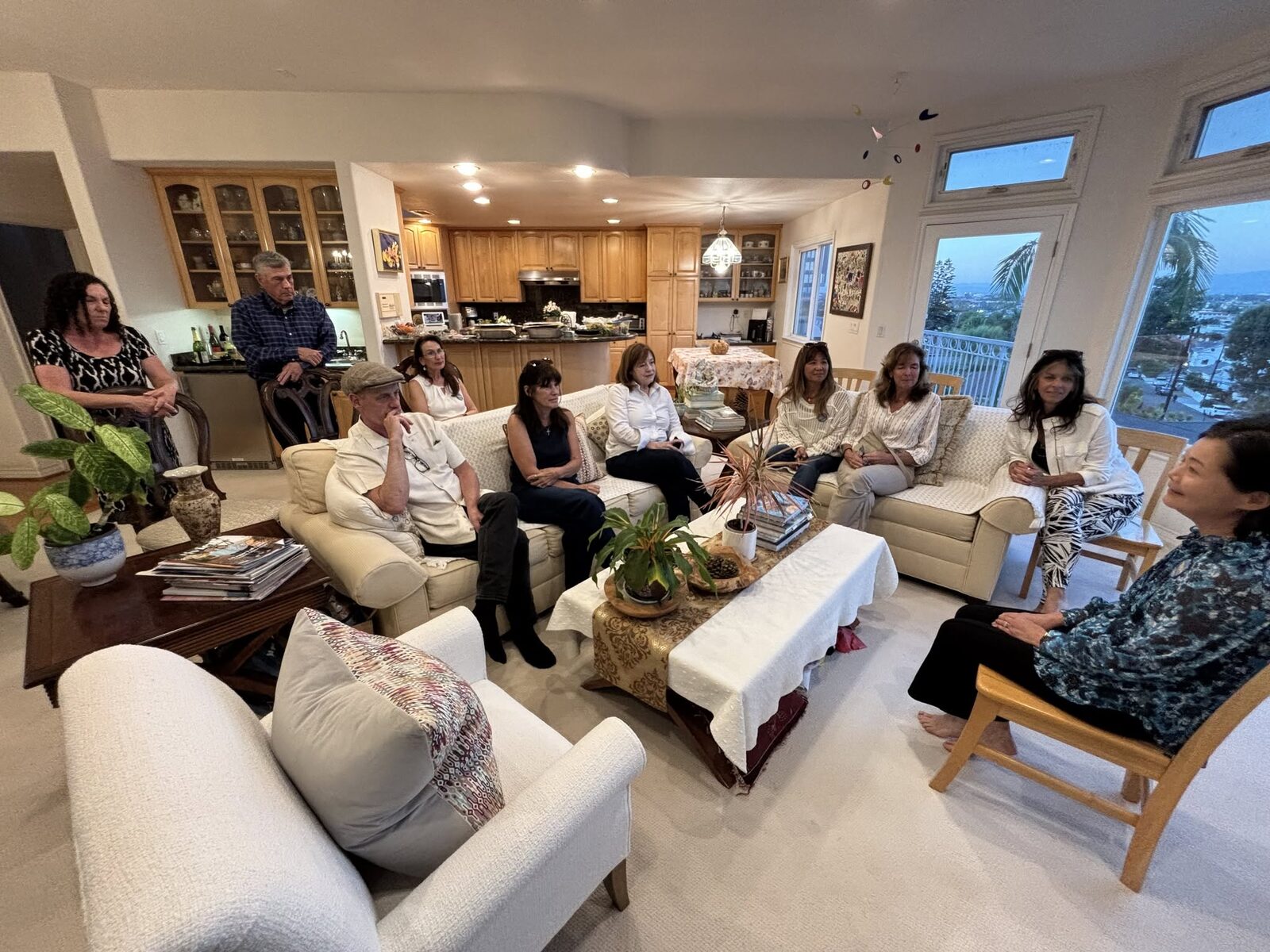 Residents gathered in a living room for the Meet & Greet