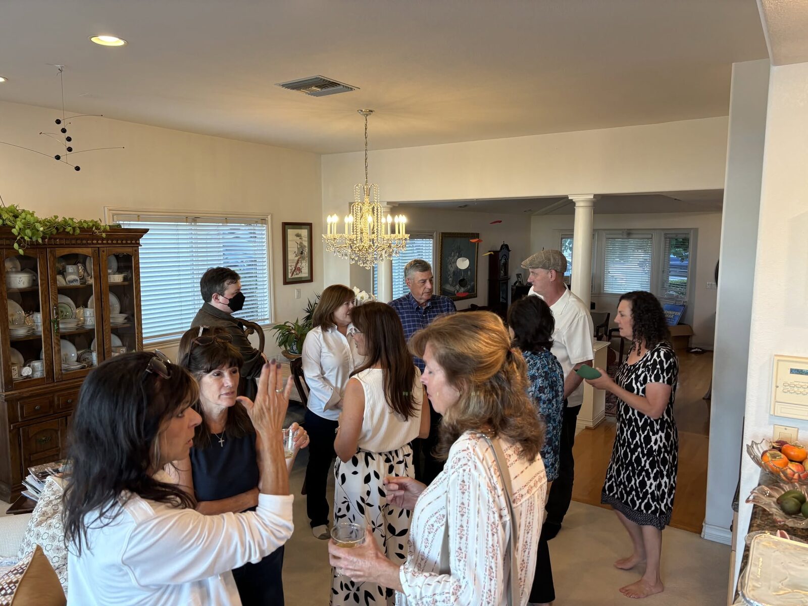 Jennifer Mak talking with guests at the Meet & Greet
