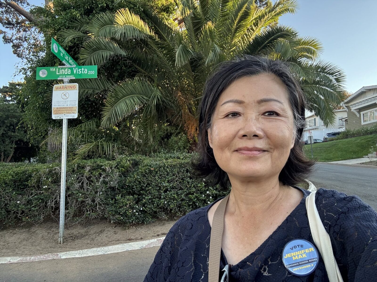 Jennifer Mak canvassing in Area D, wearing her campaign button