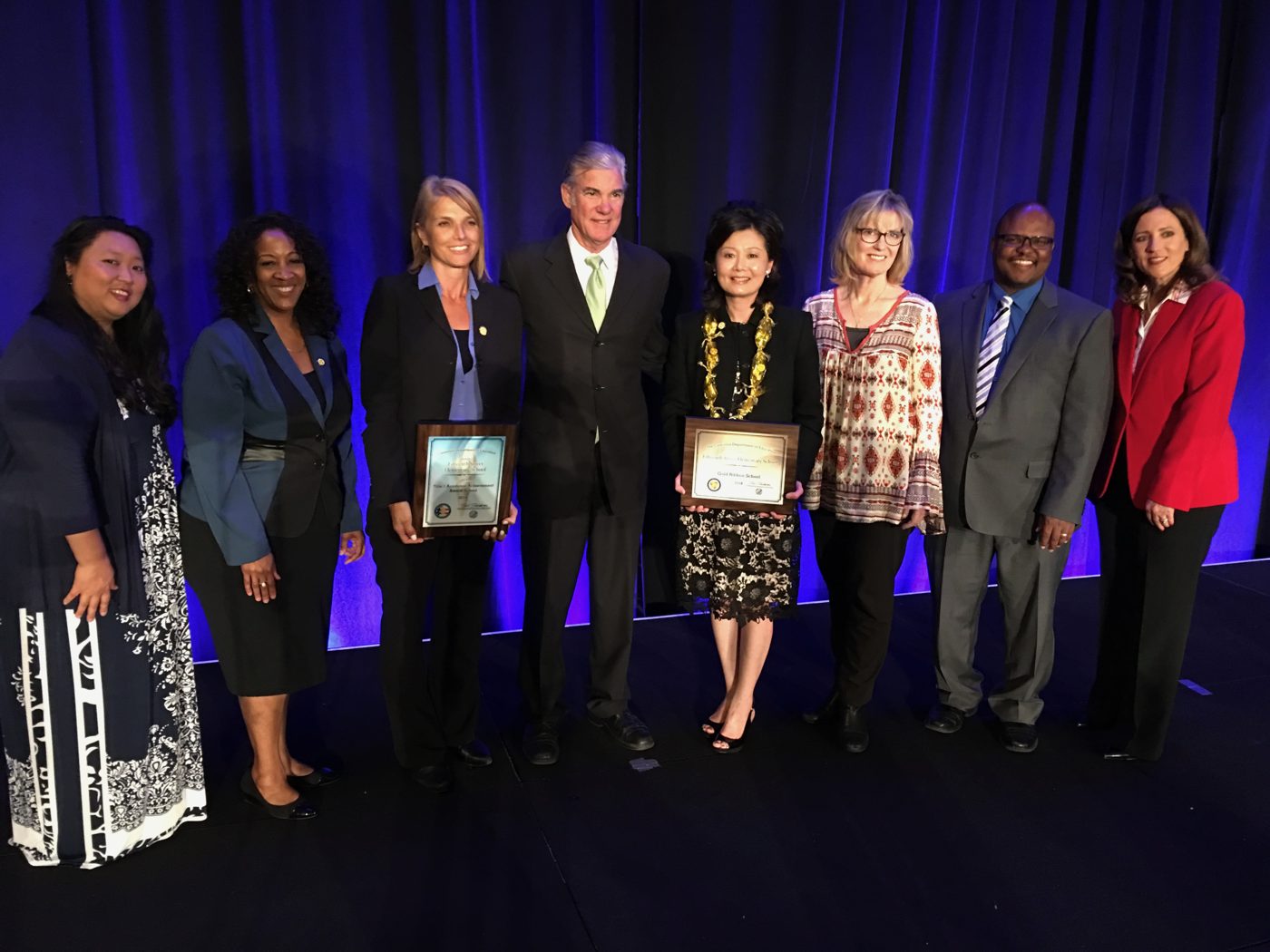 Jennifer with fellow honorees at a recognition ceremony