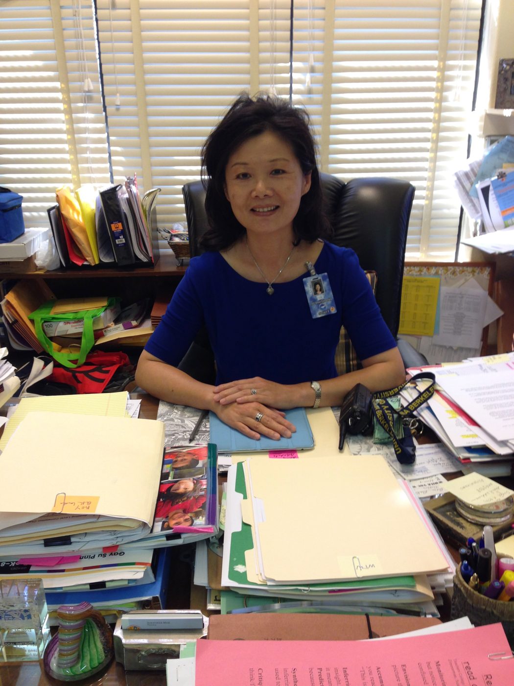 Jennifer at her desk as principal of 15th Street Elementary