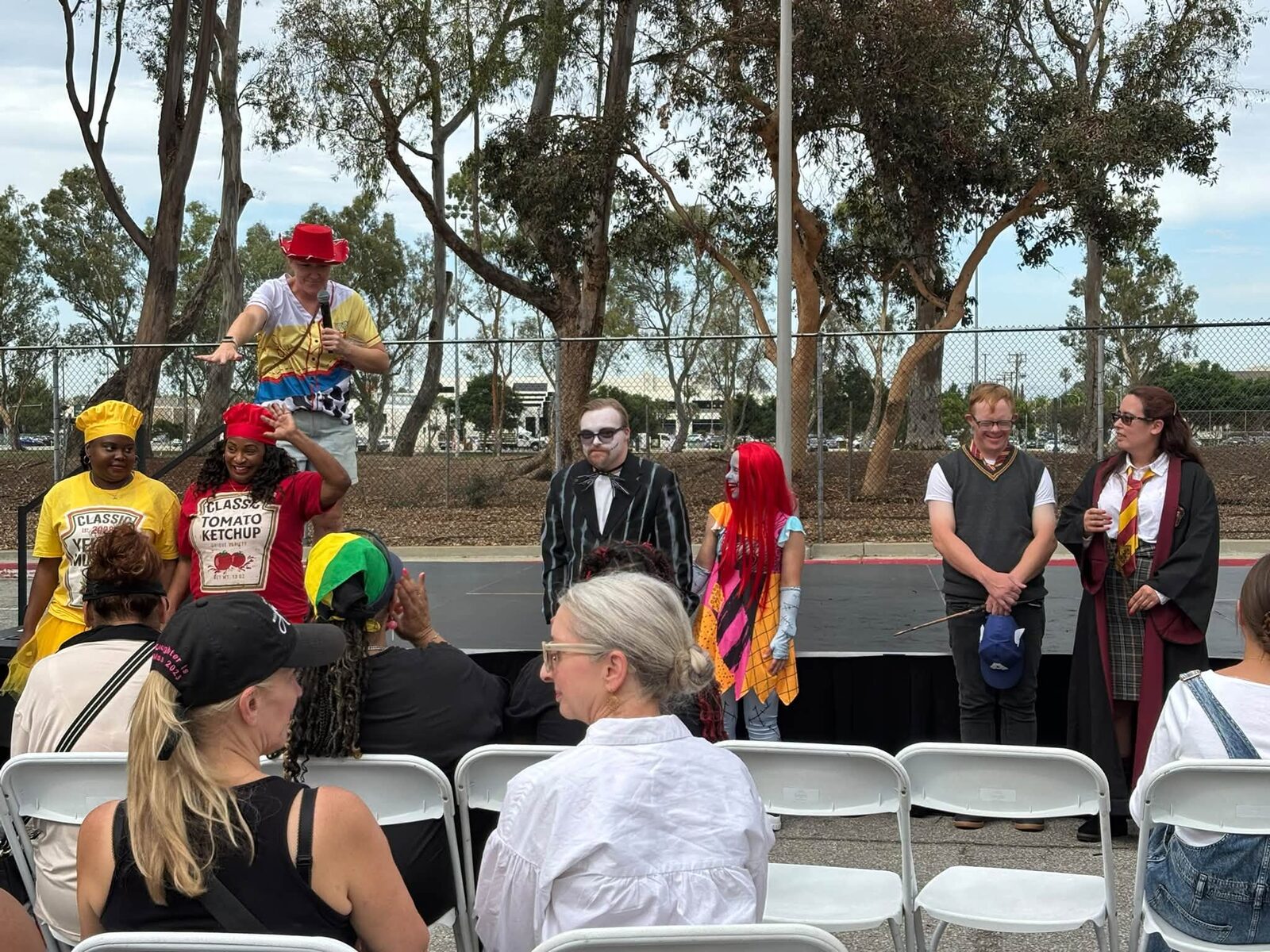 Costumed performers on stage at the ICAN Halloween Festival