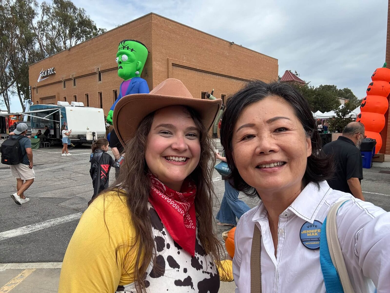 Jennifer Mak with a festival guest dressed as a cowgirl