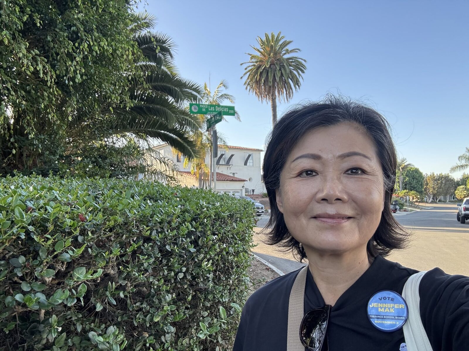 Jennifer Mak canvassing in Area D wearing her campaign button